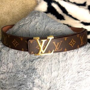 NWOT!! Inspired brown leather belt with gold logo. Comes in original dust bag.